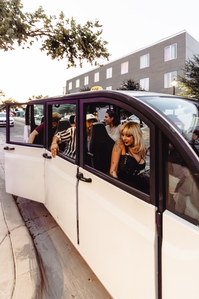Passengers enjoying a Tripz ride